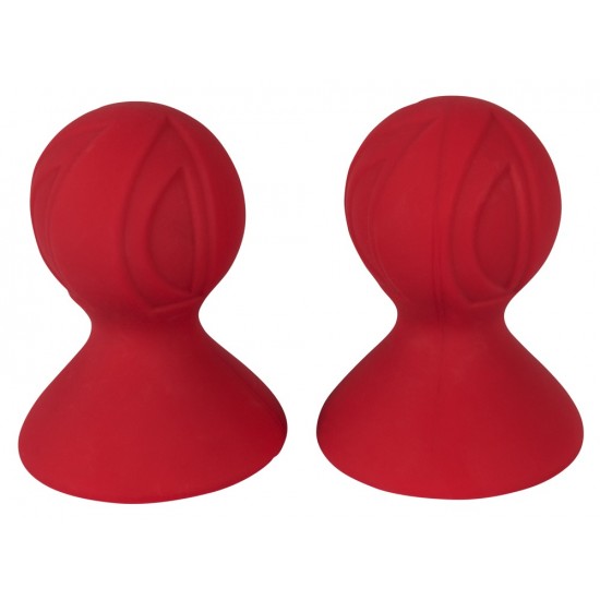 Nipple suckers with pump ball featuring multi-ply pattern. Red. 7 cm long, pumpball Ø 4 cm, contact area Ø 5.5 cm. Material: Silicone with PU coating, phthalate-free according to EU regulation REACH.