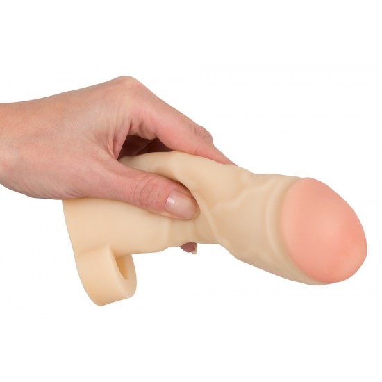 Skin-coloured penis sleeve with a testicle ring for extending the penis. With pink glans that have a large circumference. With veins. Complete length 17 cm, insertion depth 12 cm, thickness 10 mm, Ø of penis/glans max. 5